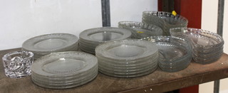A collection of moulded glass ice dishes and ditto crescent shaped salad plates 