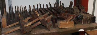 A collection of wooden moulding planes 