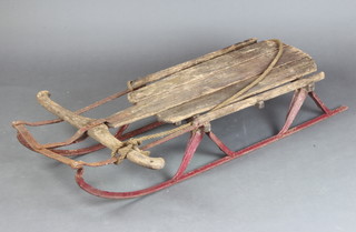 A decorative Continental steel and wooden toboggan (signs of old but treated worm) 20cm h x 118cm l x 62cm w  