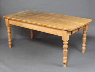 A Victorian style rectangular  pine kitchen/dining table, fitted a frieze drawer to one end, raised on turned supports 78cm h x 182cm l x 92cm w 
