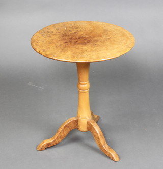 A circular figured walnut wine table raised on a turned column and tripod  base 49cm h x 44cm d 