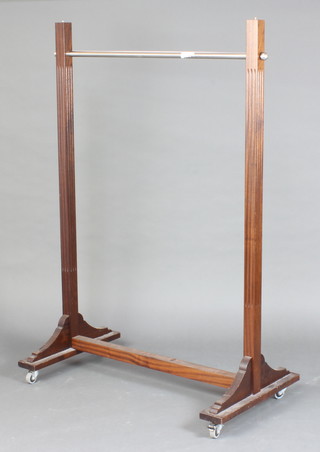 A rectangular mahogany and chrome clothes rail 153cm h x 103cm l x 57cm d (finials missing to the top) 
