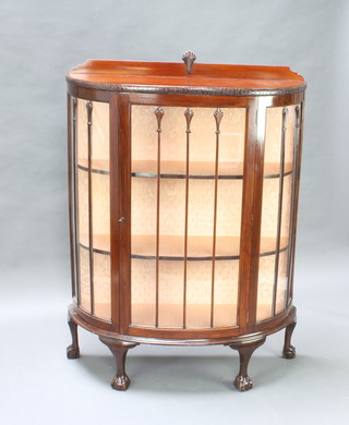 A 1930's Art Deco mahogany bow front display cabinet with raised back enclosed by astragal glazed panelled doors, raised on cabriole, ball and claw supports 134cm h x 99cm w x 39cm d 