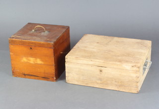 A rectangular mahogany instrument box with brass swing handle 29cm x 33cm x 33cm (locked) and a pine box with hinged lid and brass handles 19cm x 48cm x 42cm 
