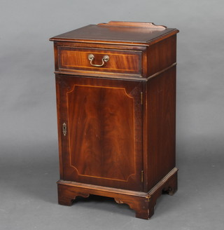 A Georgian style inlaid and crossbanded mahogany cabinet fitted a drawer above a panelled door, raised on bracket feet 85cm h x 50cm w x 41cm d 
