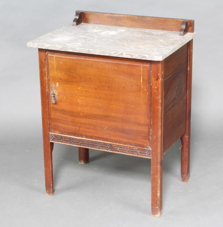 An Edwardian mahogany wash stand with grey marble top the base enclosed by a panelled door, raised on square supports 80cm h x 62cm w x 46cm d 