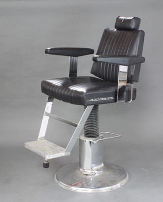A Belmont Apollo chrome barbers chair by Takara Belmont, upholstered in black rexine on a chrome base (split to the head rest and crack to the base) 