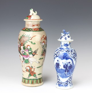 A Chinese blue and white vase decorated with panels of figures and with 4 character mark to base 19cm together with a similar lid and a crackle glazed vase and cover decorated with warriors 30cm 