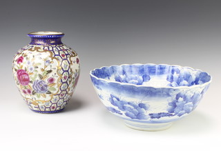 A Chinese scalloped blue and white punch bowl decorated with birds and flowers 32cm together with a modern Chinese baluster vase 23cm 