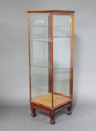 Belchem and Company, a 1920's mahogany pedestal display cabinet, fitted adjustable glass shelves raised on square tapered supports 182cm h x 55cm w x 55cm d 