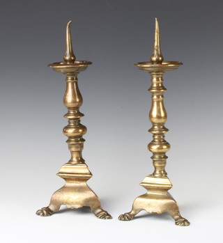 A pair of 17th Century style bronze pricket candlesticks with hoof supports 35cm x 8cm 