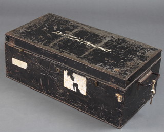 A rectangular metal tin trunk marked Rev. H R Huboid containing 2 WWII fire watcher's helmets, 3 civilian respirators and a torch 