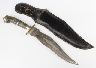 An Indian Kris style dagger with 22cm blade, horn grip and leather scabbard 