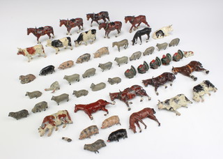 50 Britains farmyard animals including 8 shire horses (1f, some have bent legs), 3 horses (1f), a donkey, 8 cows (3 f) and a car, 5 turkeys (1f), goose (leg f), 16 sheep (3 f), yew and lamb, 4 pigs (3 f) 