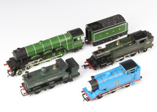 A Hornby OO gauge L5502 locomotive and tender Flying Scotsman and a Hornby GWR tank engine, an Airfix GWR tank engine and a Hornby Thomas The Tank Engine 