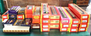 Four Hornby OO gauge R463B LNER coaches, 3 ditto R471 LNER coaches and 13 other coaches all boxed and a collection of rolling stock 