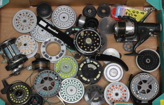 A Shakespeare Pflueger medalist centre pin fishing reel, a Kolic Lamson 4.0 centre pin reel with spare spool, a Hardy Marquess centre pin reel (handle missing), a Nash BR600 reel, 1 other reel and a collection of spare spools 