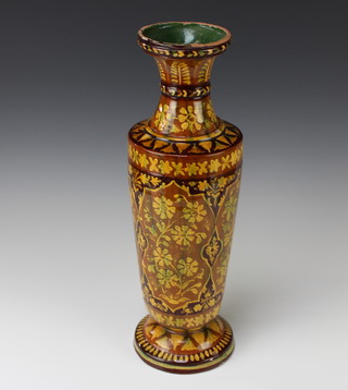 A Moroccan style earthenware tapered tan glazed vase decorated with scrolling leaves and flowers 45cm 