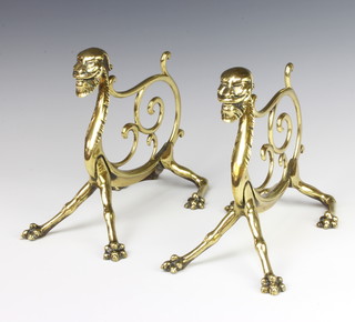 A pair of "Dresser" style Victorian brass fire dogs in the form of mythical beasts 20cm x 22cm x 13cm 
