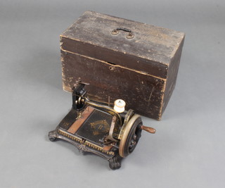 An Atlas B sewing machine complete with instructions boxed (hinge to box f) 