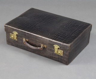 A black crocodile vanity case with brass locks 16cm x 51cm x 34cm 