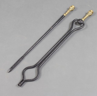 A 19th Century iron fire tongs with brass handle and matching poker