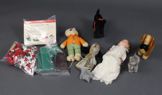 A quantity of Bayko building parts, a Canadian "A Reliable" doll, a yellow Merrythought teddy bear, 2 ditto figures of dogs, a Sweep puppet and a figure of a dog    
