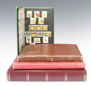 An album of various GB mint and used stamps Victoria to Elizabeth II, a stock book of various world stamps including China, GB mint, America and Spain, a red album of mint and used world stamps - Italy, Hungary, Egypt, Denmark, Czechoslovakia, Belgium and a green stock book of various mint stamps 