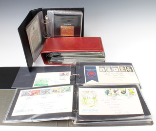 Four albums of GB Elizabeth II first day covers and an album of Auto 100 twenty five of the most famous models in the 100 years of automobile history 
