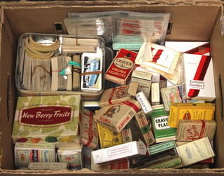 A box containing a large collection of cigarette cards, some contained in vintage packaging