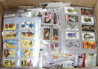 A quantity of trade and cigarette cards 