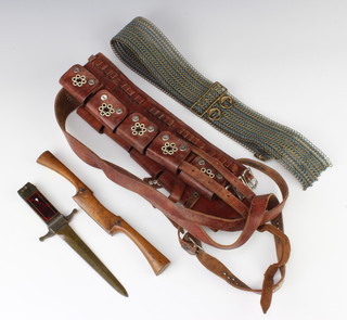 A double bladed paper knife with 14cm blade, the grip incorporating a lighter, a Nurse and Co spoke shave, a mesh belt and a leather bandolier  