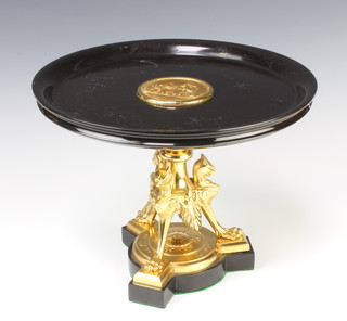 A Victorian aesthetic movement polished marble and gilt metal comporte, raised on griffin supports with triform base 24cm h x 31cm diam, 