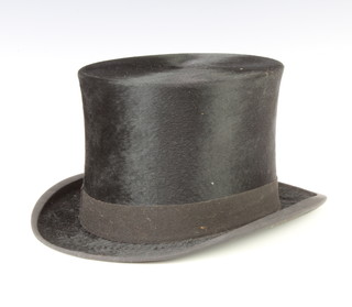 A gentleman's black top hat, size 6 3/4 