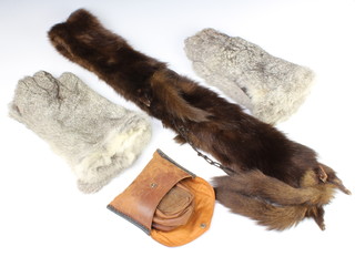 A mink stole, 2 pairs of rabbit skin gloves and a pair of enroute leather slippers and case 