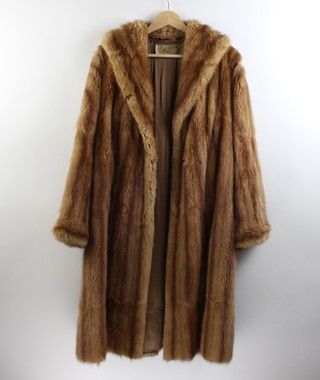 A lady's mink cape together with a faun fur coat 