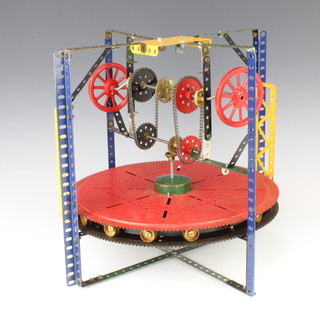 A red, blue and yellow circular Meccano mechanical model 32cm x 34cm  