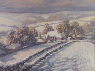 20th Century oil on board, unsigned, a winter farm view with distant hills 44cm x 60cm 
