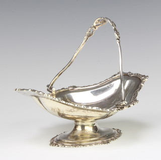 An Edwardian silver swing handle basket, raised on an oval pedestal, London 1909, 153 grams  