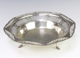 A silver shallow bowl with pierced decoration on scroll feet, Sheffield 1911, 691 grams, 30cm 