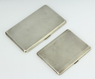 A silver engine turned cigarette case Birmingham 1940 and 2 others, 449 grams