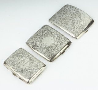 A silver cigarette case Birmingham 1913, 2 others, 261 grams