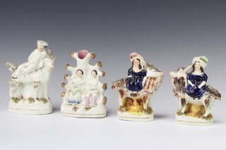 A pair of Victorian Staffordshire figures of ladies riding giant goats 13cm, ditto of a man on a giant goat 15cm and a spill vase of 2 figures in an arbour 14cm