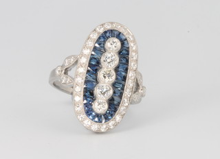 A platinum, diamond and sapphire Art Deco style up finger ring, the diamonds approx. 1ct, the sapphires approx. 1.45ct, size N 
