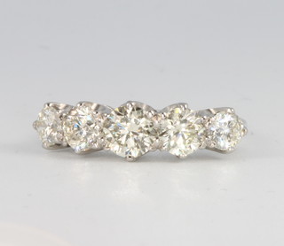 A platinum five stone brilliant cut diamond ring, approx. 2.5ct, size N 