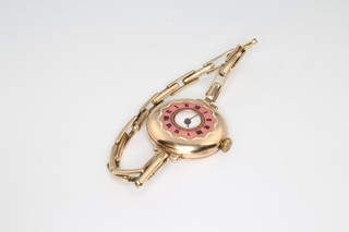 A lady's 9ct yellow gold half hunter wristwatch with enamelled case and expanding bracelet, case 25mm  