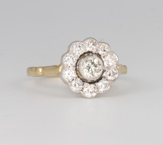 An 18ct yellow gold diamond cluster ring, approx. 0.65ct, size M 