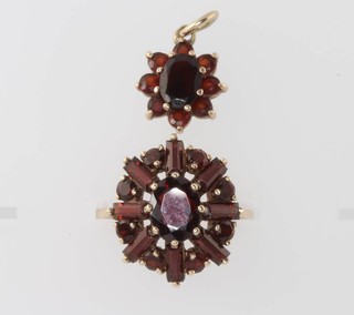 A 9ct yellow gold garnet ring size N and a ditto pendant 