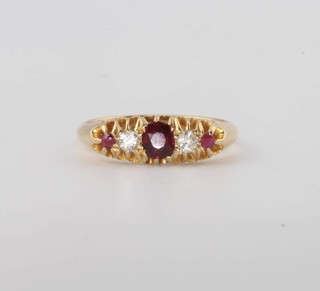 An 18ct yellow gold ruby and diamond ring size N 