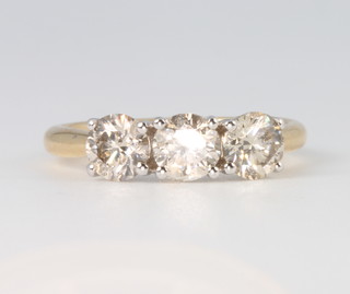 An 18ct yellow gold 3 stone diamond ring approx. 1.55ct, size M 